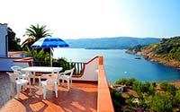 Carmignani apartments, directly on Barbarossa Beach in Porto Azzurro. Carmignani apartments